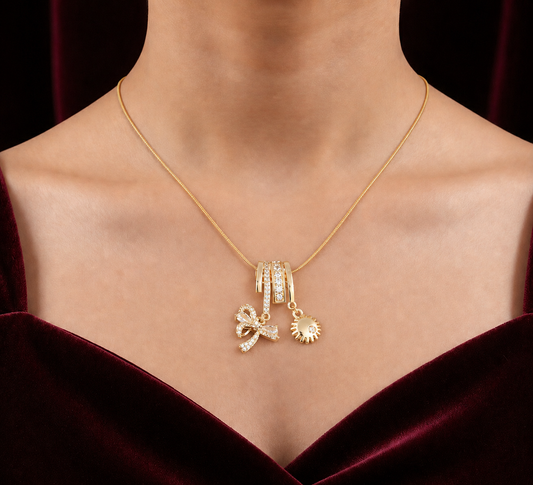 Elora Elegant Gold-Plated Charm Pendant Necklace with Bow & Sun Drop Accents