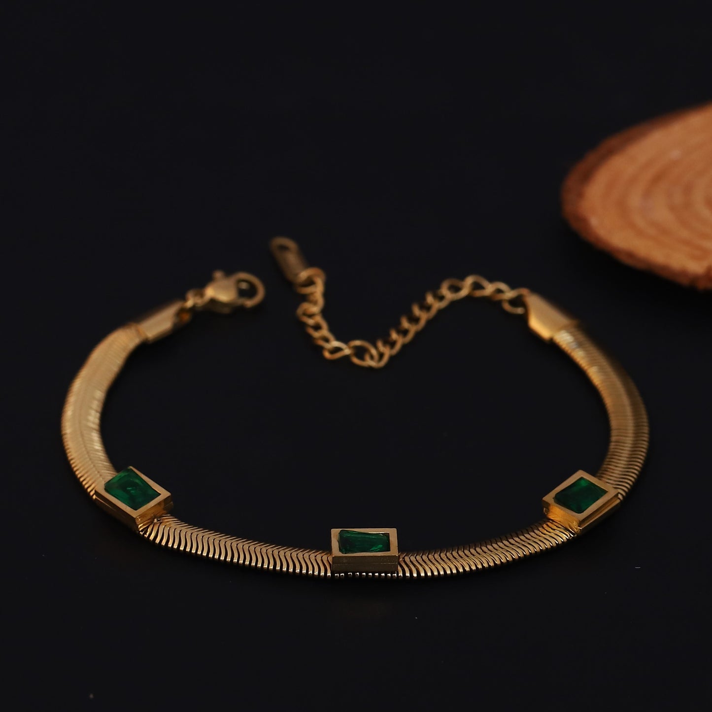 Elora Gold Plated Herringbone Bracelet with Green Emerald-Style Stones