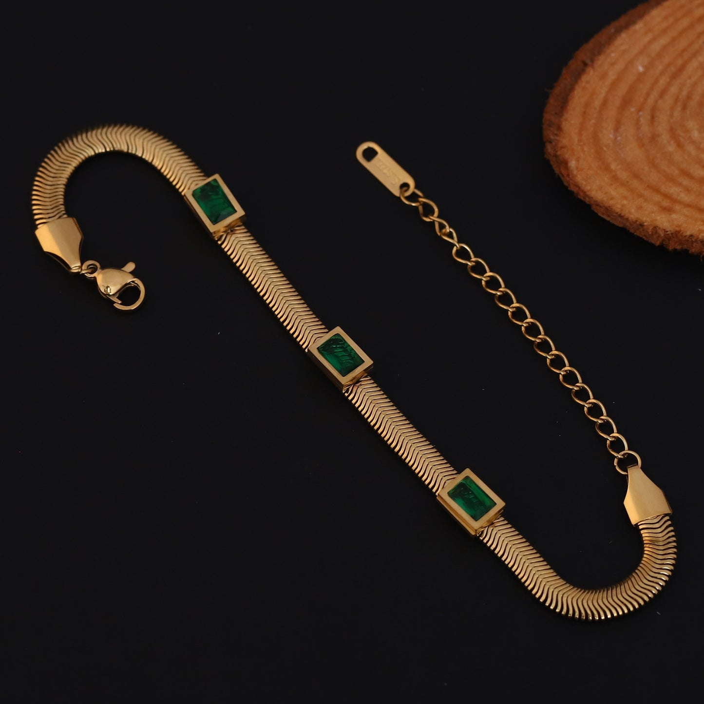 Elora Gold Plated Herringbone Bracelet with Green Emerald-Style Stones
