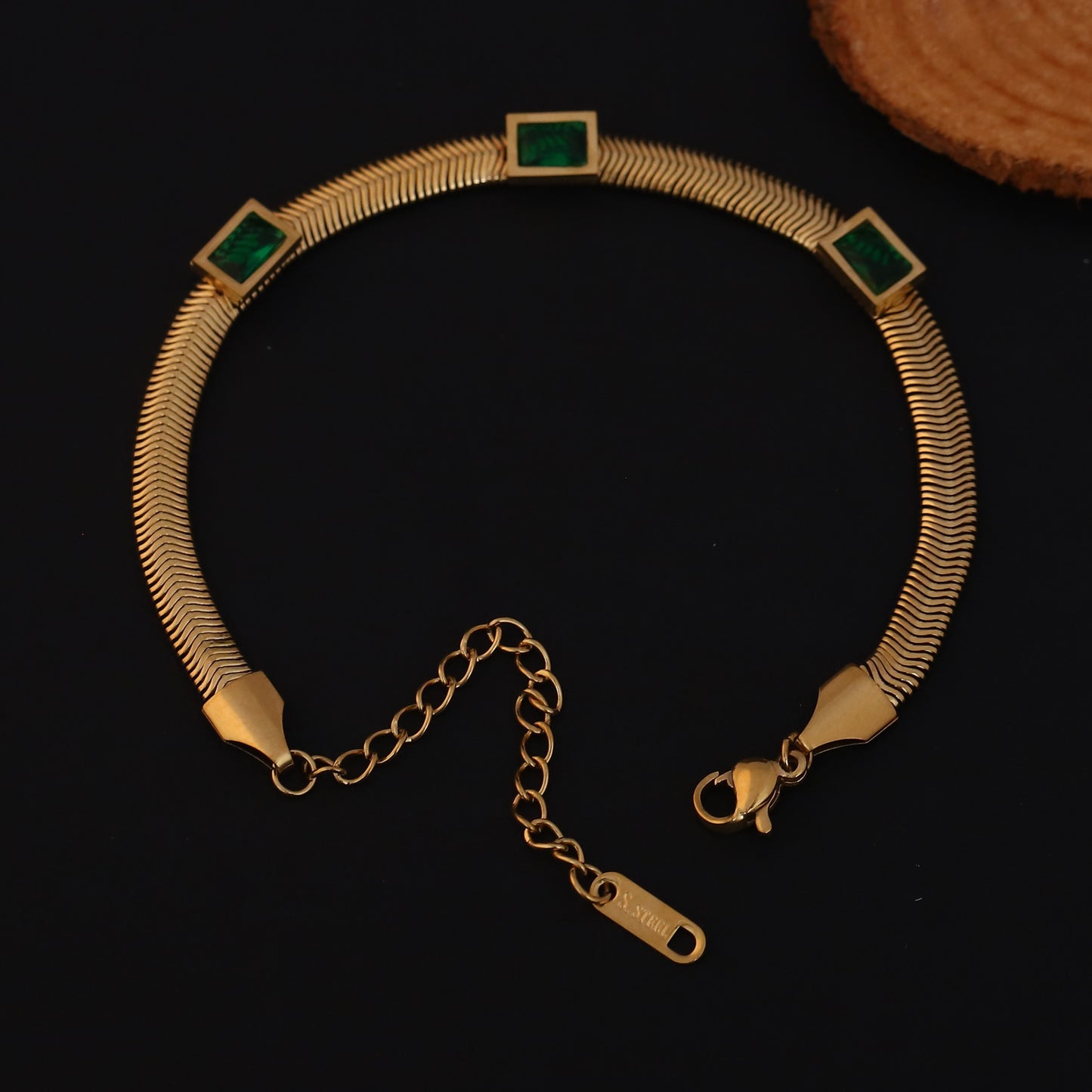 Elora Gold Plated Herringbone Bracelet with Green Emerald-Style Stones