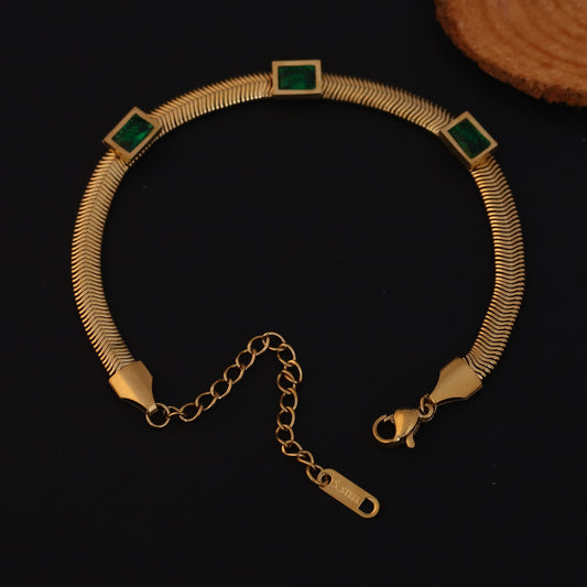 Elora Gold Plated Herringbone Bracelet with Green Emerald-Style Stones